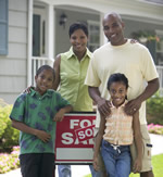 happy family in front of new house